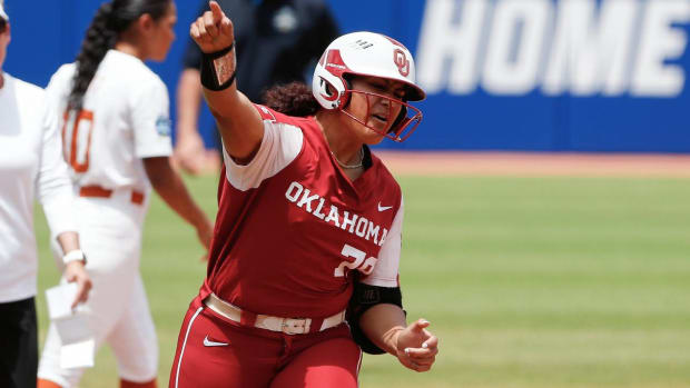 Oklahoma utility Jocelyn Alo (78) celebrates on the way to home plate after hitting a home run during the first inning of an NCAA Women’s College World Series softball game against Texas on Saturday, June 4, 2022, in Oklahoma City. (AP Photo/Alonzo Adams)